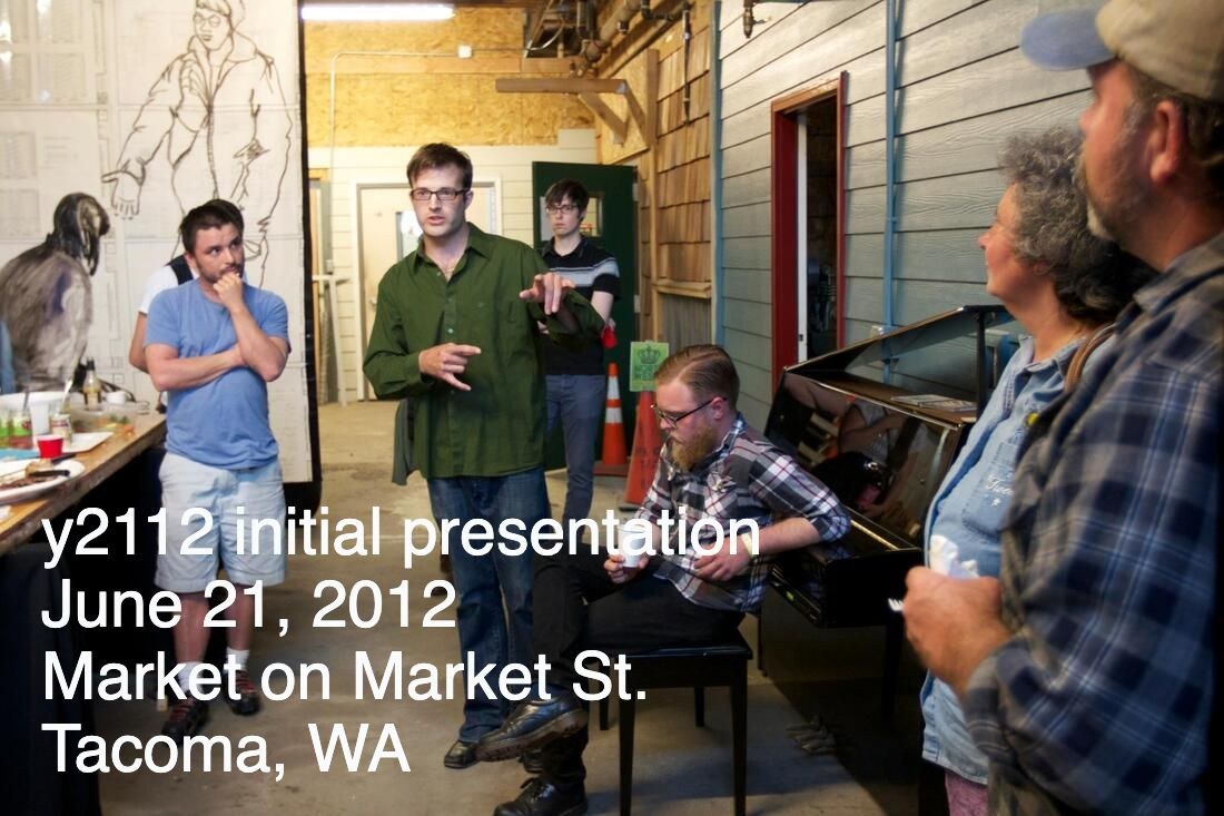 y2112: the initial presentation, June 21, 2012. Colin Scott Reynolds (seated) played.
